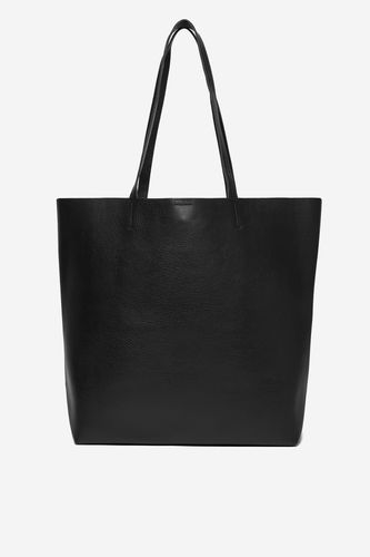 Torebka shopper pokazana na wprost, widoczny cały korpus i uchwyty.