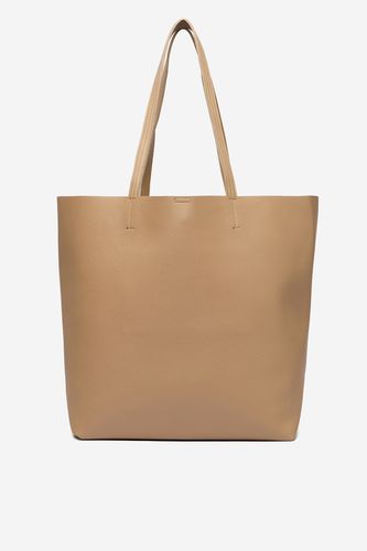Torebka shopper widoczna z przodu, uchwyty skierowane ku górze.