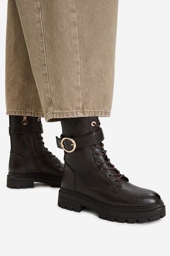 Šněrovací vyšší obuv U.S. POLO ASSN. EO-SVETA002W/GY1 Hnědá